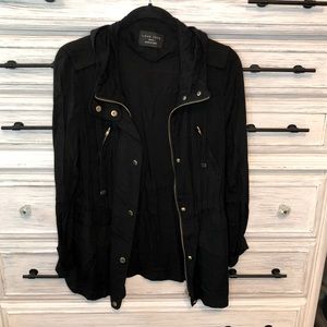 Black cinch waist hooded jacket with gold accents